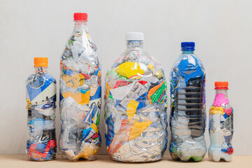Eco bricks made from plastic waste lined up in different sizes