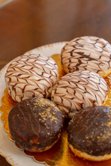 Chocolate donuts served on a plate