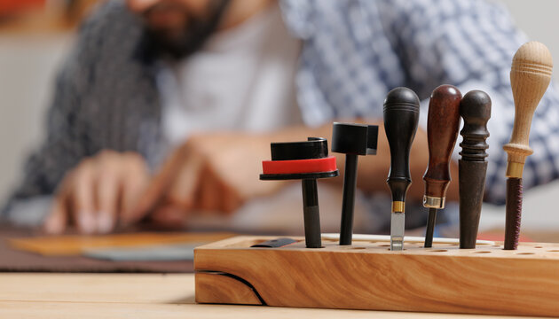 Banner shoemaker industry business, Natural leather brown color with tools. Workshop background tailor shoes maker from skin