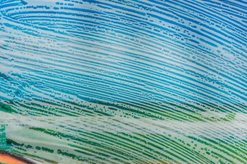 Soap foam on glass- cleaning of contaminated surfaces. Clean background- clipart photo