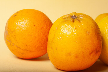 oranges on a yellow background
