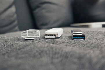 A variety of USB drives are displayed beautifully on a stylish textured surface representation