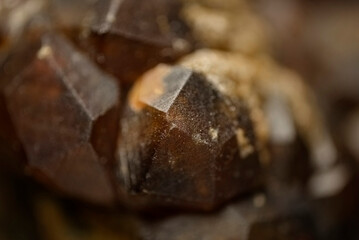 Garnet (andradite, hessanite) crystals. Sinyaya Rechka deposit, Far East, Russia. High magnification microphotograph- photo scale 10X.