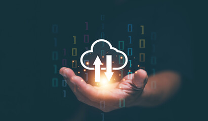 Cloud computing concept. Businessman holding glowing upload and download icons. Data transfer management, cloud storage, digital synchronization, information technology and online, connectivity.