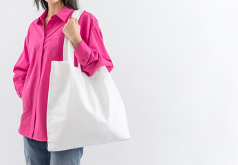 Photo with model in an oversized white bag, mock-up photography, front view, wearing a pink shirt on a white background