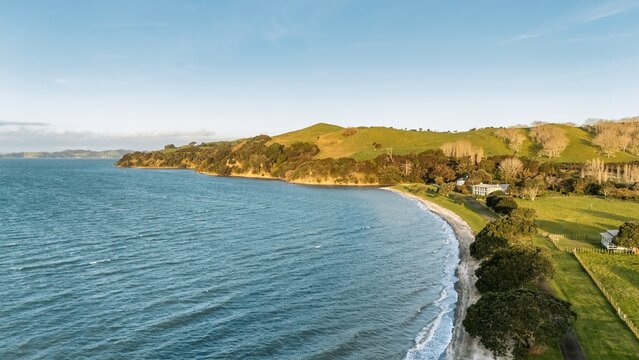 Aerial View from Ocean, Beach, Green Trees and Mountains in Duder Regional Park, New Zealand - Auckland Area	
