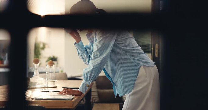 Woman, writing and coffee for remote work from home, phone and project management review. Person, notebook and freelance writer with smartphone, mobile app or tea cup with admin by window at house