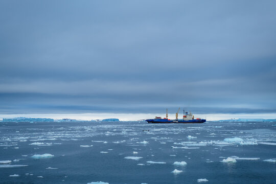 Prospect Point, Antarctica. Seabourn Pursuit expedition cruise ship on icy sea in Antarctica.