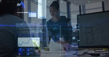 Leaning female manager discussing project in office, with laptop, blueprints and data overlays