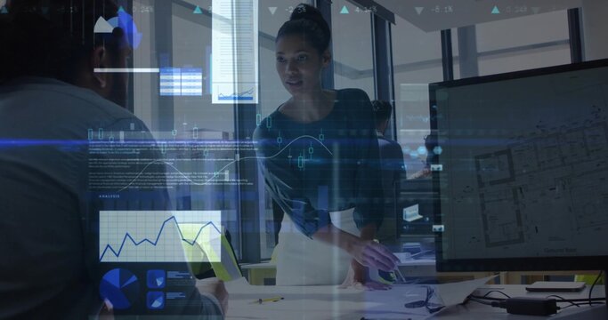 Leaning female manager discussing project in office, with laptop, blueprints and data overlays