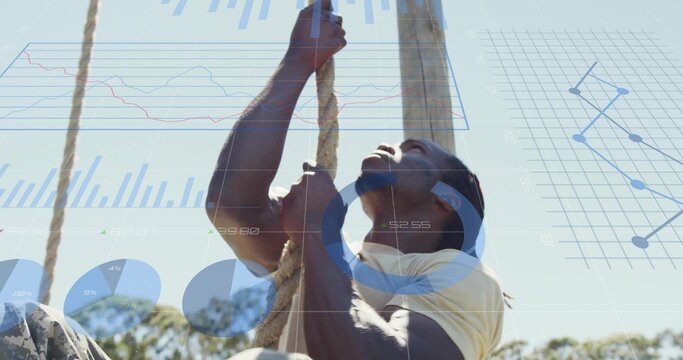 Climbing adult African American male gripping thick rope on obstacle course, with data overlays