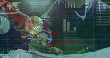 Operating surgeons using forceps and cutting instrument on blue drape in OR, with data overlays