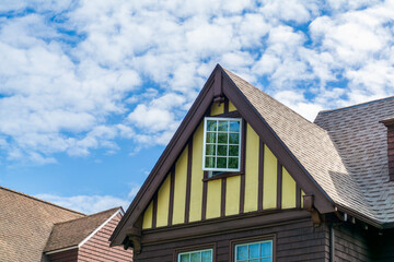 Traditional Tudor-style family home with steep gable roof and decorative trim in Brookline, Massachusetts, USA