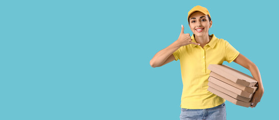 Female courier with pizza boxes showing 