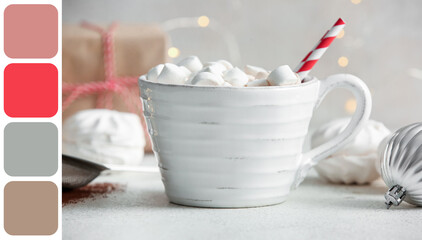 Cup of hot cocoa with marshmallows on white background