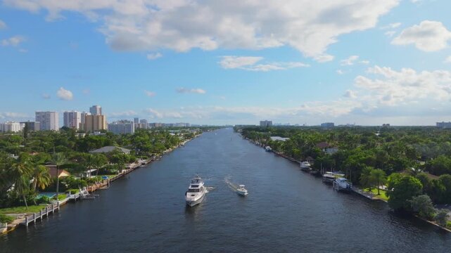 Aerial drone view of Florida intracoastal with city and yacht
