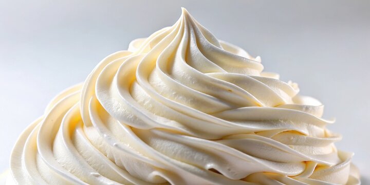 Creamy swirls of decadent frosting, a delightful confectionery peak, smooth texture and elegant design, perfect for culinary inspiration