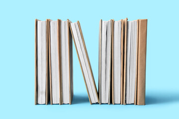 Row of books on blue background