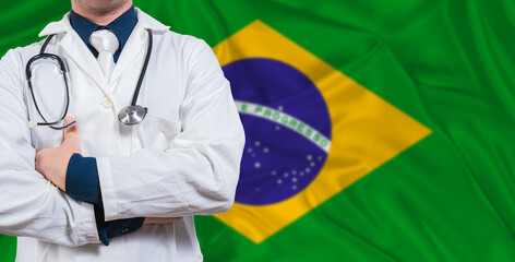 Male doctor with stethoscope on Brazil flag. Doctor holding stethoscope on Brazil flag
