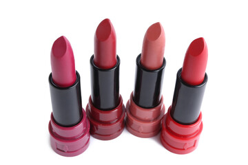 Different lipsticks on white background