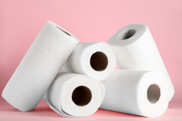 Rolls of paper towels on pink background