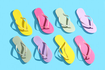Colorful flip-flops on blue background