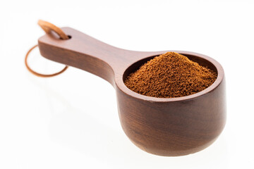 Dry instant ground coffee in a measuring spoon - Coffea