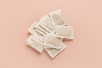 Tea bags on beige background