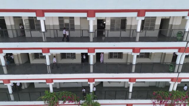 Drone footage of red-white classroom corridor building &ndash; Police DAV Public School, Jalandhar, Punjab, India &ndash; Oct 15th, 2025
