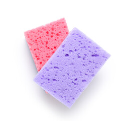 Purple and pink cleaning sponges on white background