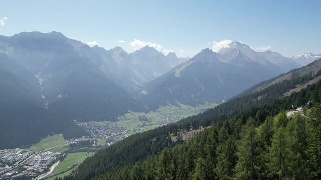 Aerial view of a picturesque alpine scenery with the massive mountain peaks of the Stubai Alps in the Tyrol region of Austria in summer