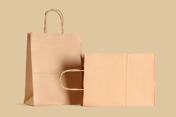 Paper bags on beige background. Food delivery service