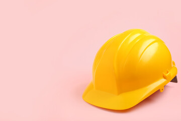Fototapeta premium Hardhat on pink background, closeup