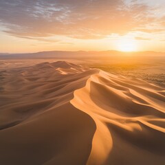 A desert with sand dunes and mountains in the distance