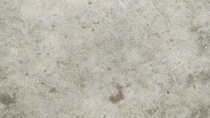 Grungy cement texture background. Spots of white paint on a gray concrete background, texture, photo. old cement. The gray concrete shows signs of time and exposure, creating an authentic industrial 
