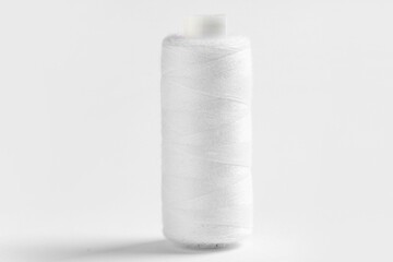 Spool of thread on white background