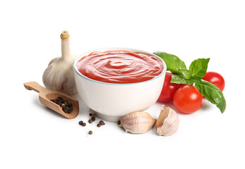 Bowl of tasty tomato sauce and different spices on white background