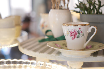 Elegant teacup displayed in a charming cafe setting