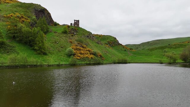 Aerial shot of St Anthony's Chapel Ruins with Arthur's seat in the background, Holyrood Park, Edinburgh