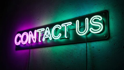 Glowing neon sign C O N T A C T U S in vibrant pink blue and green light on textured wall for