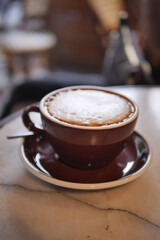 Coffee cup on a table with smooth foam on top