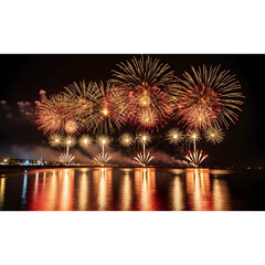 Fireworks Display Over Water with Reflections at Night
