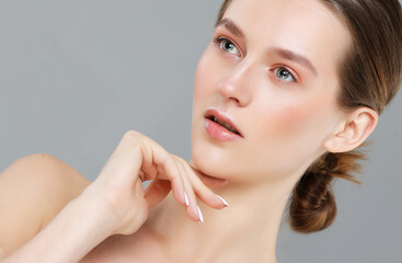 Pure beauty. A beautiful young woman with a perfect face. The concept of beauty, youth, and clear skin.