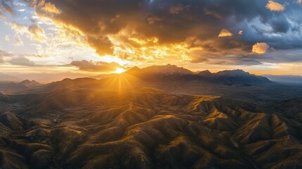 A view of a mountain range with a sunset