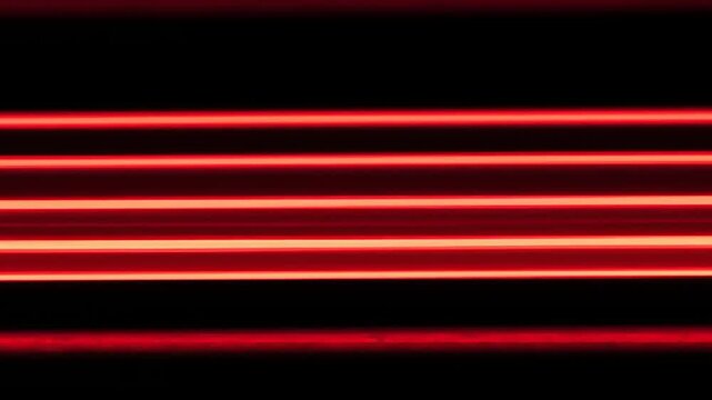 Abstract image of horizontal red light streaks against a black background