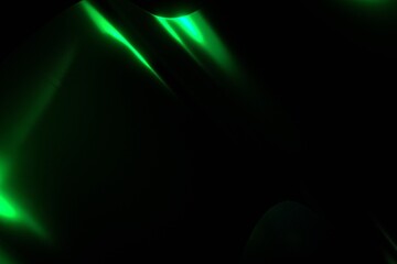 Abstract Neon Green Light Reflections on a Dark Glossy Background