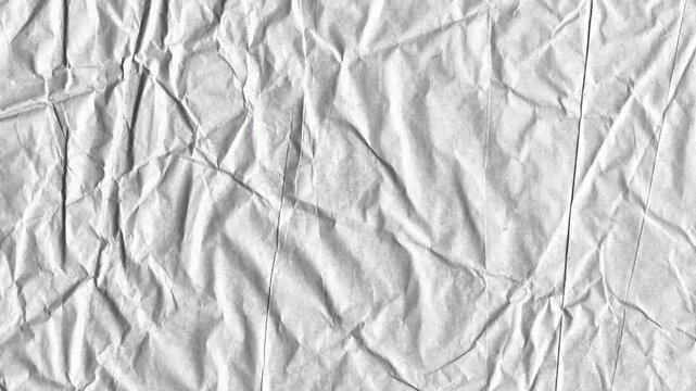 The texture of white paper is crumpled. Background for various purposes, soft wrinkle and crease effect.