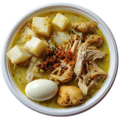 Indonesian Lontong Opor Ayam. Traditional chicken curry soup with rice cake and egg. Authentic Asian food isolated, top view.