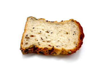 Sliced multigrain bread topped with pumpkin seeds, sunflower seeds, sesame, and black sesame.
