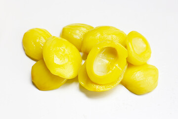 Sweet pickled Ma-Muang Bao (Thai small mango) halves without seed.